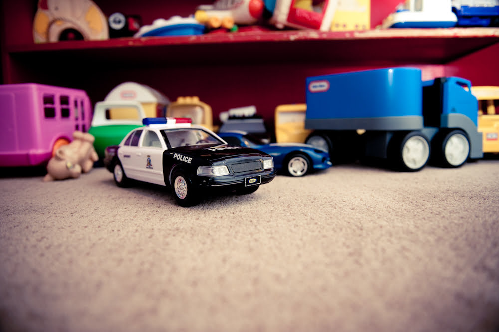 Toy cars and trucks on the shelf