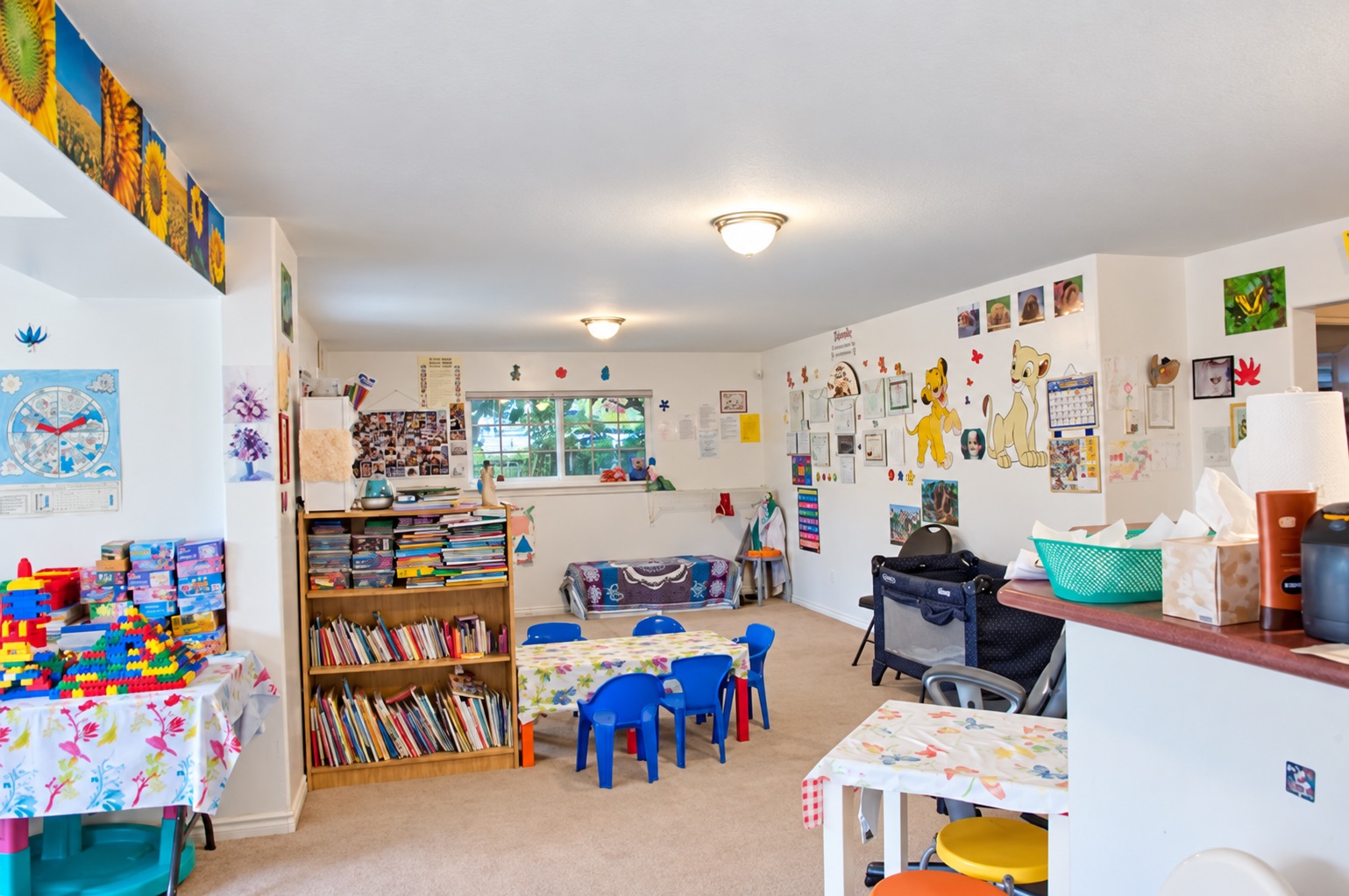 The bright playroom at Stars Childcare, with the book corner