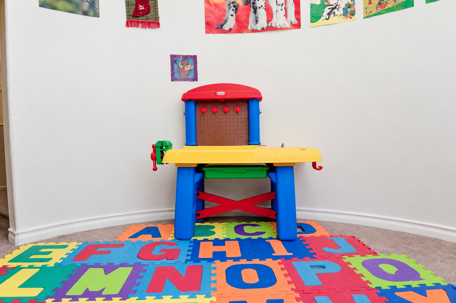 A craft corner with an alphabet play mat at Stars Childcare